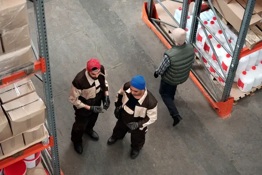 Representative image of a technical logistics team coordinating stock in a warehouse.